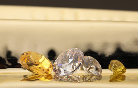 Beautiful shiny gemstones on light background, closeup