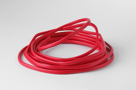 Insulated red electrical wire isolated on white