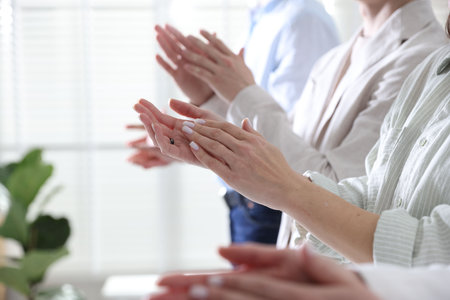 People applauding during meeting indoors, closeup viewの写真素材