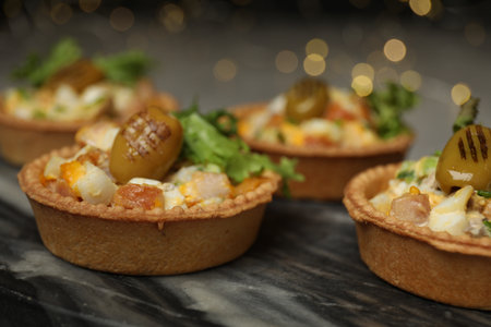 Tartlets with delicious filling on table, closeup. Bokeh effectの写真素材