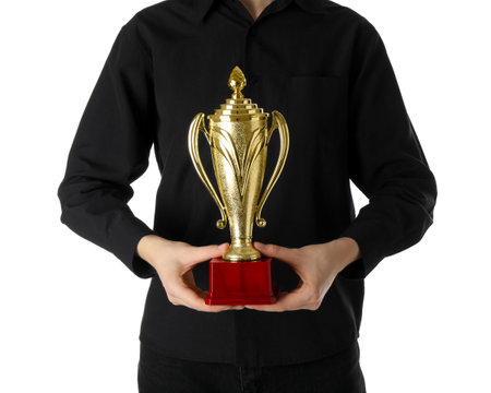 Woman with golden trophy cup on white background, closeupの写真素材