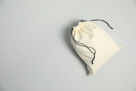 Cotton bag on grey background, top view. Space for textの写真素材