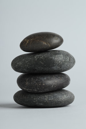 Stack of rocks on gray background. Harmony and life balanceの写真素材
