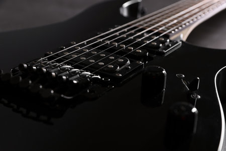 Modern electric guitar on black background, closeupの写真素材