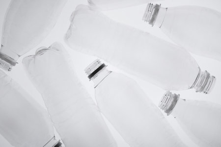Empty plastic bottles on white background, top viewの写真素材