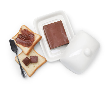 Tasty sandwiches with chocolate butter and knife isolated on white, top view