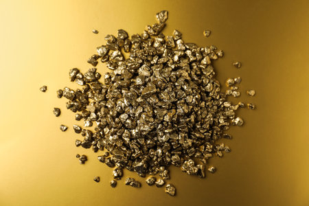 Gold nuggets on shiny background, top viewの写真素材