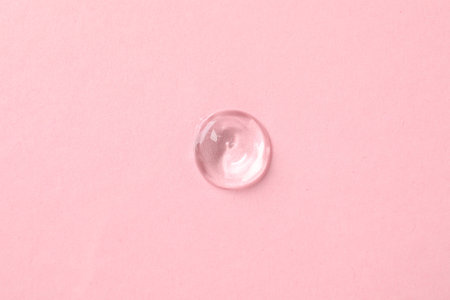 Sample of cosmetic product on pink background, top viewの写真素材