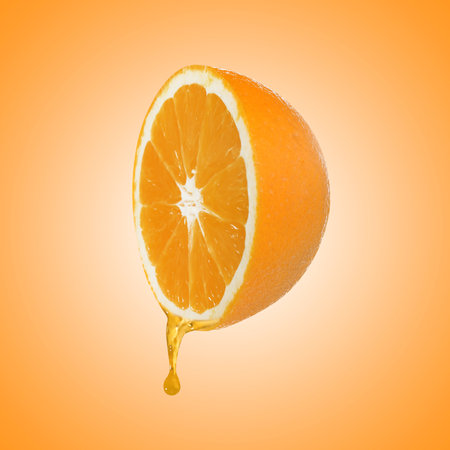 Fresh orange and drop of juice on color gradient backgroundの写真素材