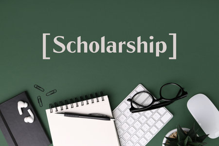 Scholarship. Flat lay composition with different office stationery on green table
