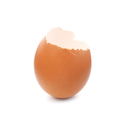 Piece of cracked eggshell isolated on whiteの写真素材