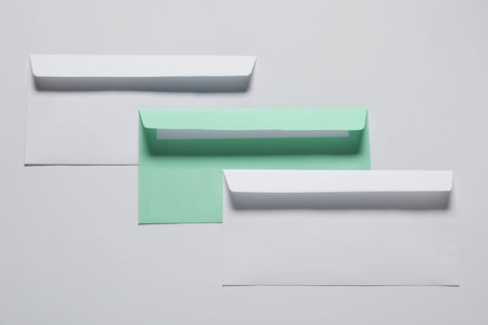 Paper envelopes on white background, top view. Mockup for design