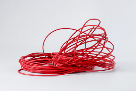 Insulated red electrical wire isolated on white
