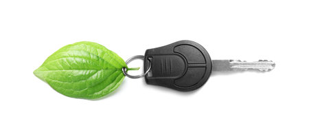 Car key with green leaf isolated on whiteの写真素材