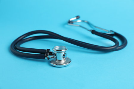 Stethoscope on light blue background, closeup.の写真素材