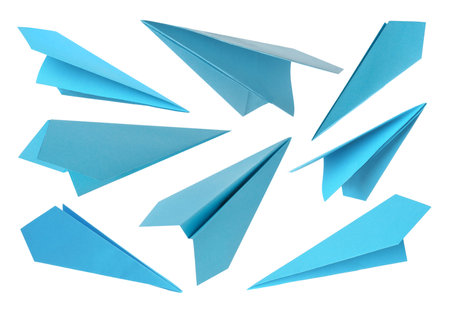 Light blue paper planes on white background, setの写真素材