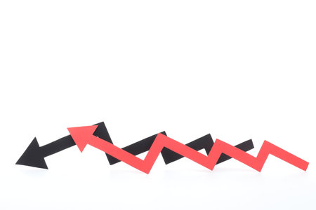 Two color paper arrows isolated on whiteの写真素材