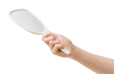 Woman with mirror on white background, closeupの写真素材