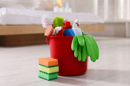 Different cleaning products and supplies on floor indoorsの写真素材