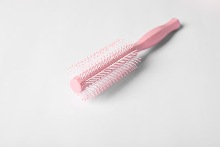 Hairdresser tool. Round pink brush on white backgroundの写真素材