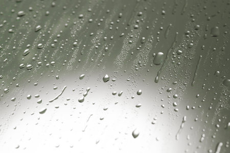 Water drops on gray glass surface, closeupの写真素材