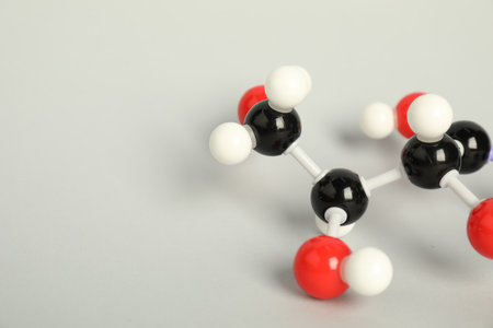 Molecule of vitamin C on light gray background, closeup and space for text. Chemical modelの写真素材