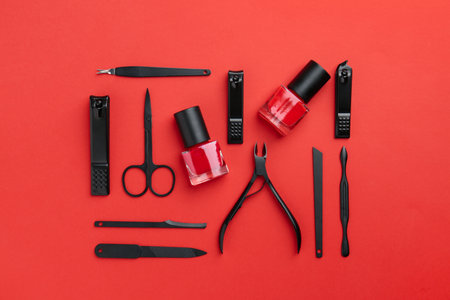 Set of pedicure tools on red background, flat layの写真素材