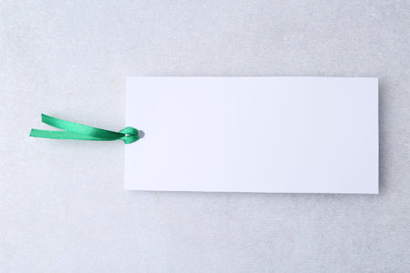 One paper bookmark on light gray background, top viewの写真素材