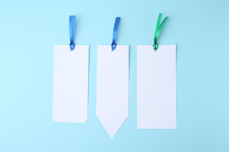 Paper bookmarks on light blue background, top viewの写真素材