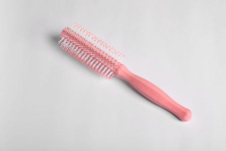 Hairdresser tool. Round pink brush on white background, top view