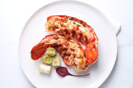 Delicious lobster with green onion on white table, top viewの写真素材