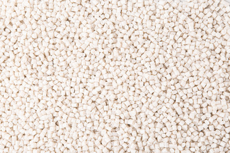 Pile of plastic granules as background, top viewの写真素材