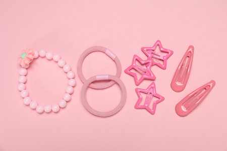 Different hair accessories on pink background, flat layの写真素材