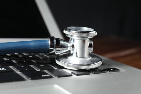 Technical support concept. Stethoscope on laptop keyboard, closeupの写真素材