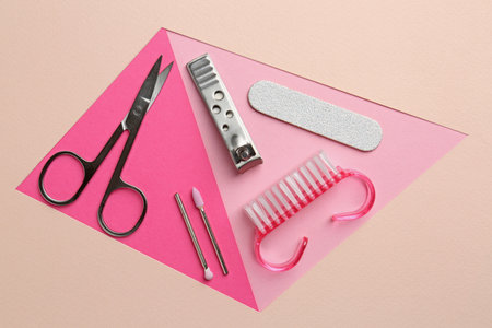 Set of pedicure tools on color background, flat layの写真素材