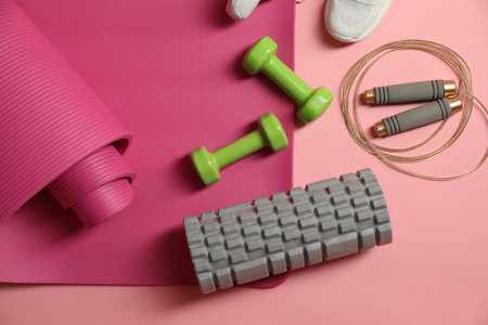 Different gym stuff on pink background, flat layの写真素材