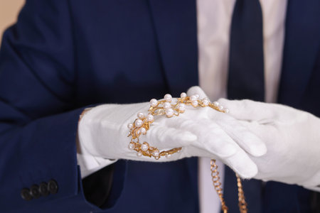 Appraiser in gloves with luxury jewelry, closeupの写真素材