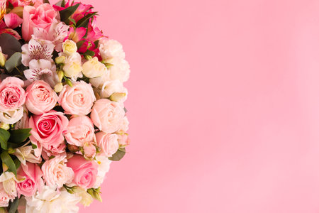 Bouquet of beautiful flowers on pink background, top view. Space for textの写真素材