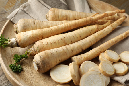 Raw parsley roots on wooden table, closeupの写真素材