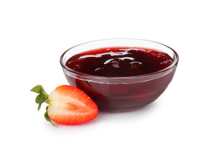 Tasty strawberry sauce in bowl and fresh berry isolated on whiteの写真素材