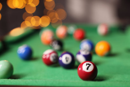 Many colorful billiard balls on green table indoors, closeupの写真素材