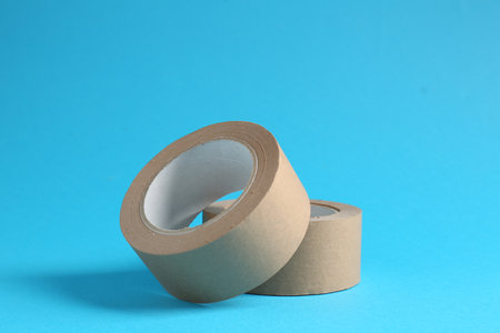 Rolls of masking tapes on light blue backgroundの写真素材