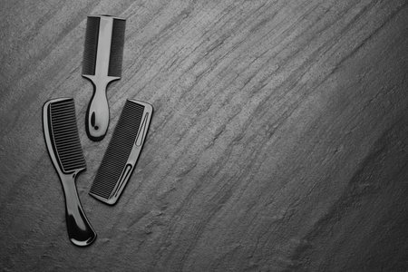 Different plastic hair combs on gray background, top view. Space for textの写真素材