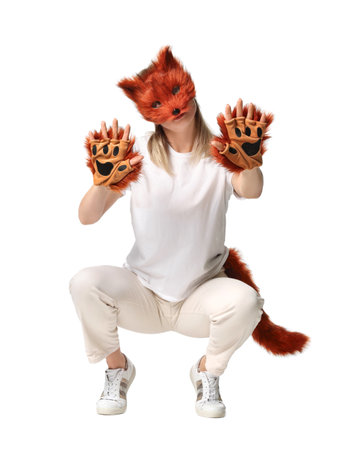 Quadrobics. Woman wearing fox mask, gloves and tail on white backgroundの写真素材
