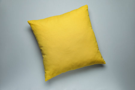 One decorative pillow on grey background, top viewの写真素材