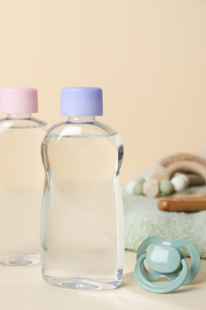 Baby oil and bath accessories on color backgroundの写真素材