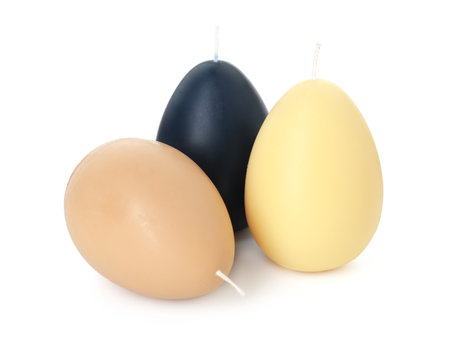 Colorful egg-shaped candles isolated on white. Easter decorの写真素材