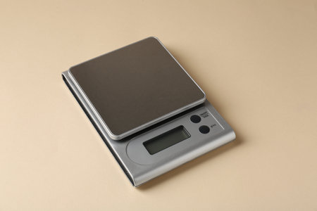 Modern electronic kitchen scale on beige background, closeupの写真素材