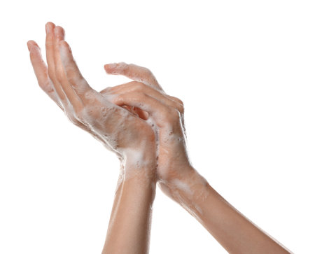 Woman washing hands with foaming soap on white background, closeup. Hygieneの写真素材