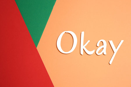 Word Okay on color background, top viewの写真素材
